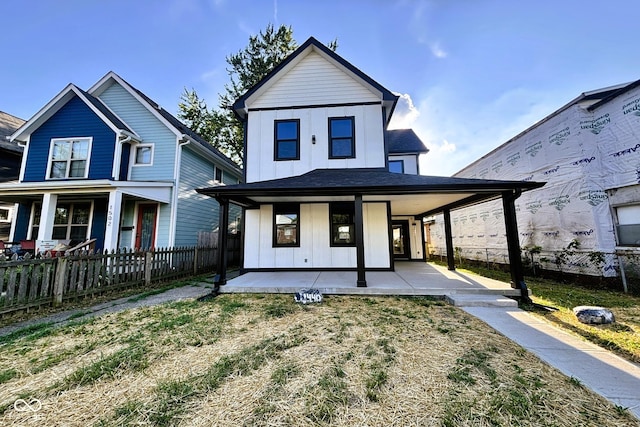 1440 S New Jersey St, Indianapolis, IN 46225 - view of front of property featuring board and batten siding and a porch