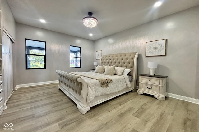 1440 S New Jersey St, Indianapolis, IN 46225 - bedroom featuring light wood-style floors, a chandelier, and recessed lighting