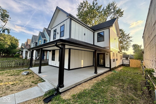 1440 S New Jersey St, Indianapolis, IN 46225 - rear view of property with a patio and board and batten siding