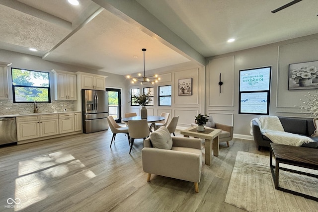 1440 S New Jersey St, Indianapolis, IN 46225 - dining area featuring a chandelier, light wood-type flooring, a decorative wall, and recessed lighting