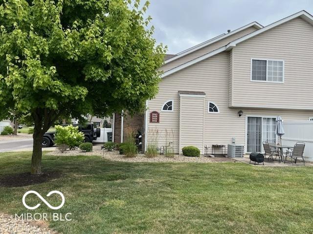 5931 Marina View Ln, Indianapolis, IN 46237 - back of property featuring a lawn and a patio area