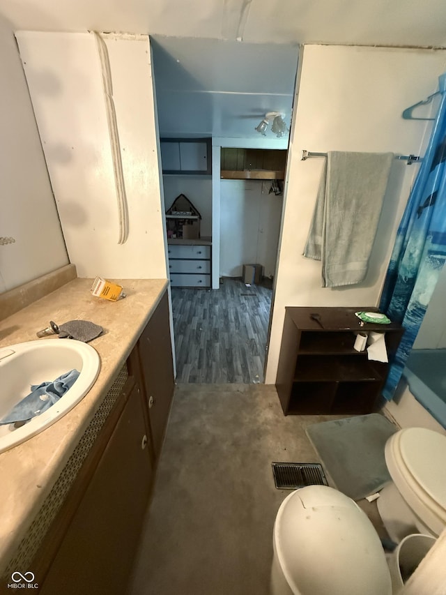 133 Michigan St, Clayton, IN 46118 - bathroom featuring vanity and wood finished floors
