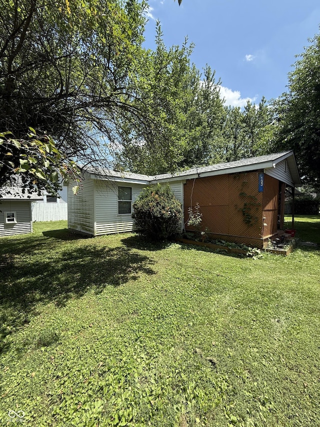 133 Michigan St, Clayton, IN 46118 - back of house featuring a lawn