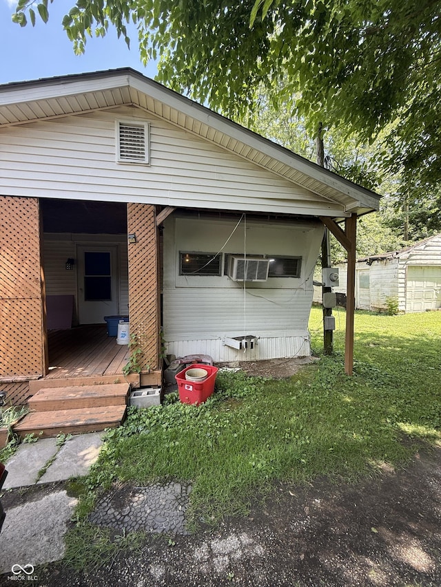 133 Michigan St, Clayton, IN 46118 - view of side of property featuring a lawn and covered porch