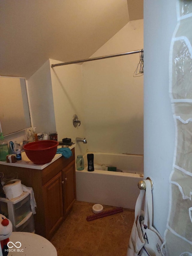 202 E Pearl St, Trafalgar, IN 46181 - bathroom featuring vanity, vaulted ceiling, and shower / bathtub combination