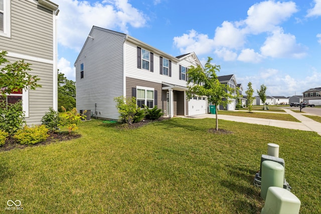 197 N Fairfield Dr, Danville, IN 46122 - traditional-style house with driveway, a front yard, a residential view, and a garage
