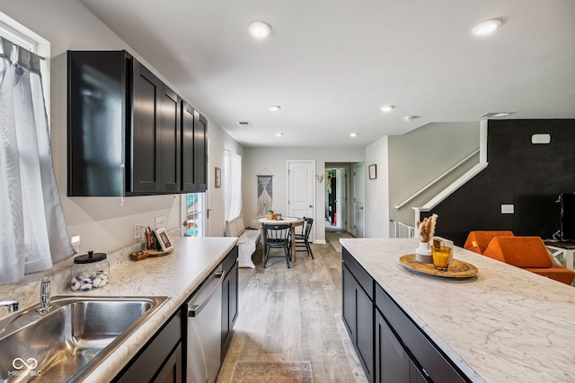 197 N Fairfield Dr, Danville, IN 46122 - kitchen with dishwasher, light wood finished floors, dark cabinetry, light countertops, and recessed lighting