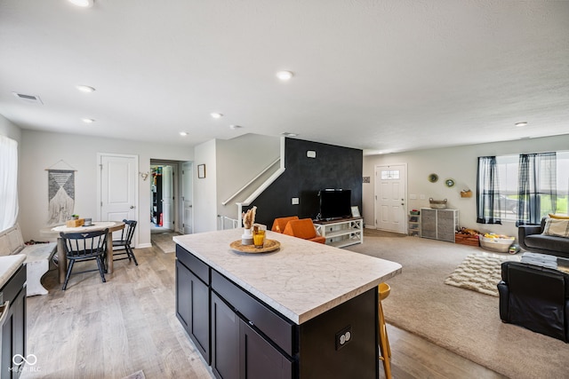 197 N Fairfield Dr, Danville, IN 46122 - kitchen featuring open floor plan, light countertops, a center island, light wood-style flooring, and recessed lighting