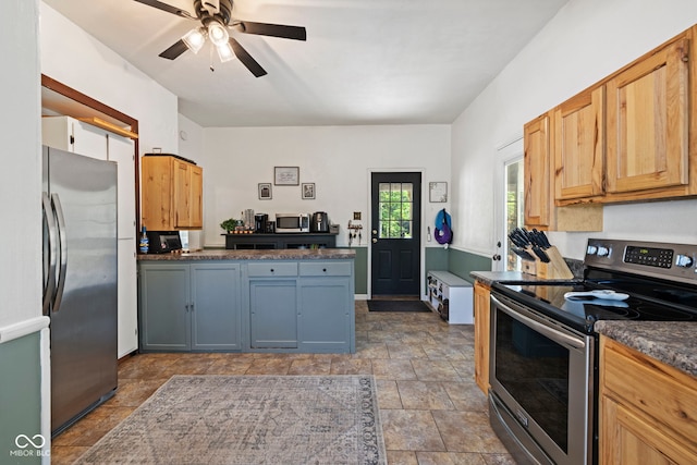 631 S State Road 39, Danville, IN 46122 - kitchen featuring stainless steel appliances, stone finish floors, dark countertops, and ceiling fan