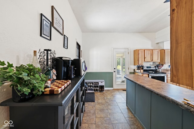 631 S State Road 39, Danville, IN 46122 - kitchen featuring appliances with stainless steel finishes, dark countertops, and dark stone finish floors