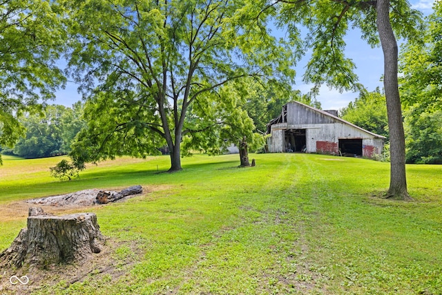 631 S State Road 39, Danville, IN 46122 - view of green lawn with an outdoor structure and a detached garage