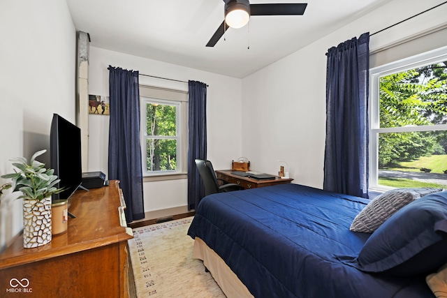 631 S State Road 39, Danville, IN 46122 - bedroom featuring multiple windows, wood finished floors, and ceiling fan