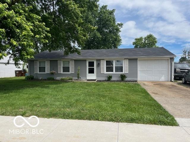 608 High School Dr, Edinburgh, IN 46124 - ranch-style house with driveway, an attached garage, and a front lawn