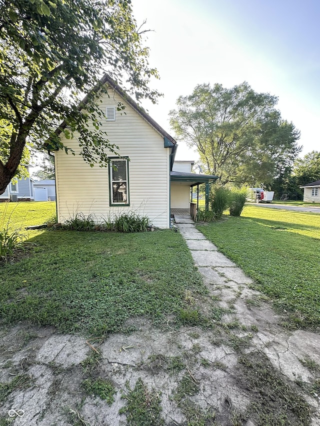 107 S Nebraska St, North Salem, IN 46165 - view of side of home with a lawn and a porch