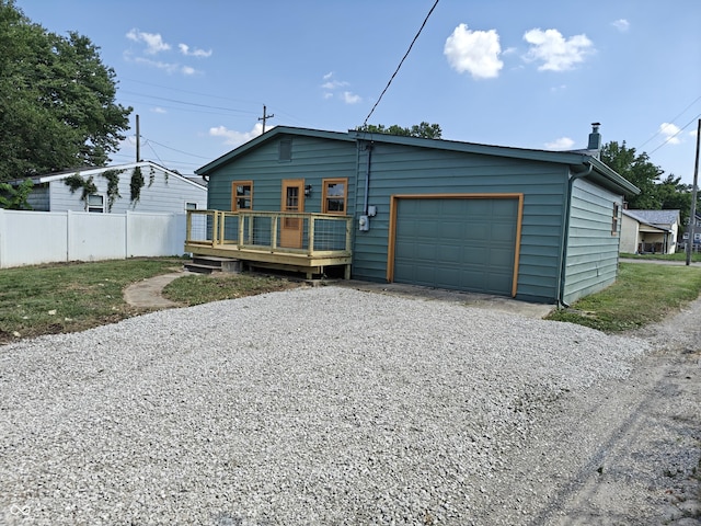 316 E Mechanic St, Shelbyville, IN 46176 - view of front of house featuring driveway, a deck, and a garage