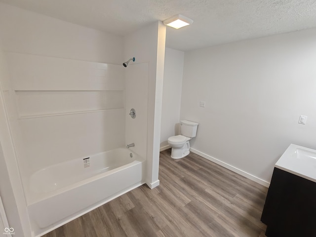 316 E Mechanic St, Shelbyville, IN 46176 - full bathroom with wood finished floors, shower / bath combination, vanity, and a textured ceiling