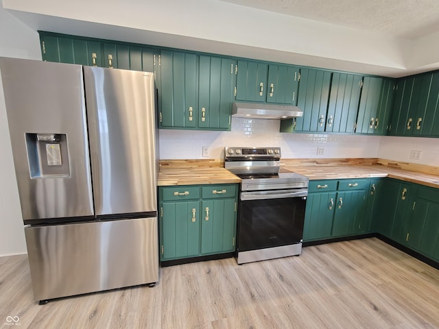 316 E Mechanic St, Shelbyville, IN 46176 - kitchen with stainless steel appliances, under cabinet range hood, light wood-style floors, and wood counters