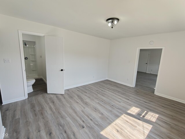 316 E Mechanic St, Shelbyville, IN 46176 - empty room with wood finished floors and baseboards