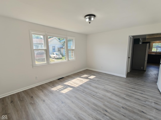 316 E Mechanic St, Shelbyville, IN 46176 - empty room featuring baseboards and wood finished floors