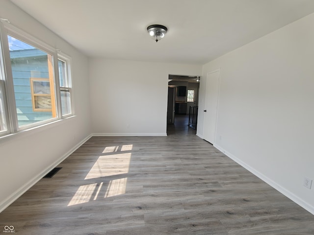 316 E Mechanic St, Shelbyville, IN 46176 - empty room with wood finished floors and baseboards