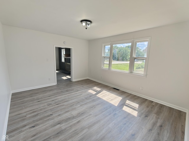 316 E Mechanic St, Shelbyville, IN 46176 - unfurnished room featuring baseboards and wood finished floors