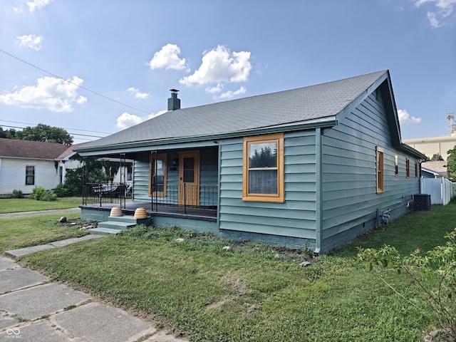 316 E Mechanic St, Shelbyville, IN 46176 - bungalow-style home with a porch, a front lawn, and a chimney