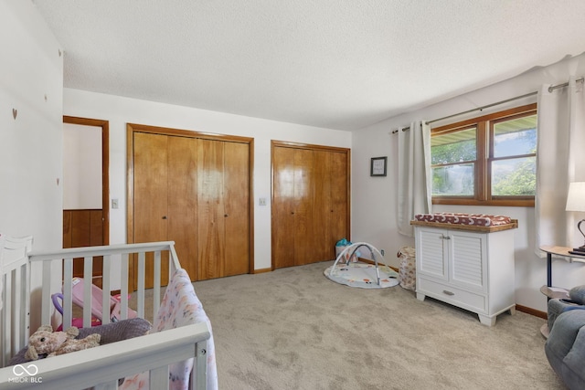 10816 N US Highway 231, Cloverdale, IN 46120 - bedroom with carpet, two closets, and a textured ceiling