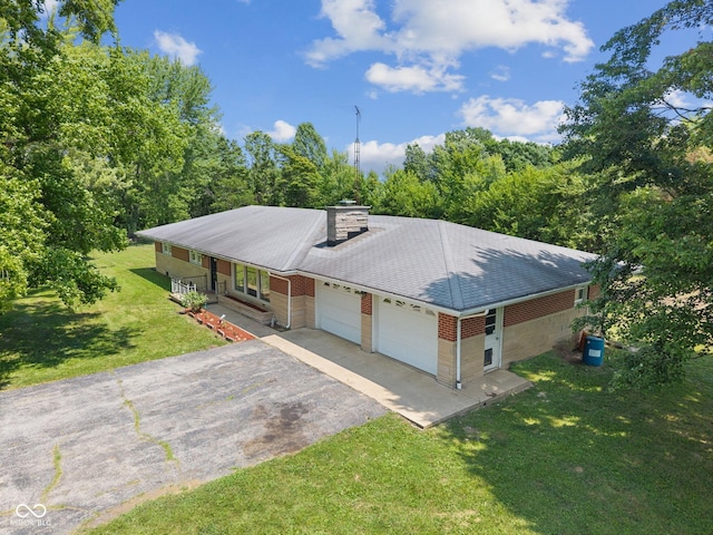 10816 N US Highway 231, Cloverdale, IN 46120 - view of front of house featuring an attached garage, asphalt driveway, a front lawn, a chimney, and a shingled roof