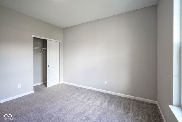 2541 Riviera Pl, Greenwood, IN 46143 - unfurnished bedroom with carpet flooring and a closet