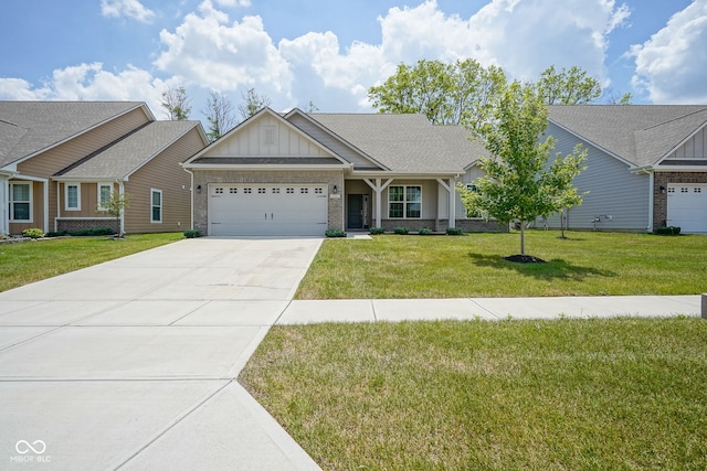 2541 Riviera Pl, Greenwood, IN 46143 - craftsman-style home with board and batten siding, brick siding, an attached garage, and driveway