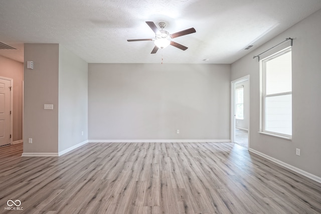 2541 Riviera Pl, Greenwood, IN 46143 - unfurnished room featuring light wood finished floors and a ceiling fan