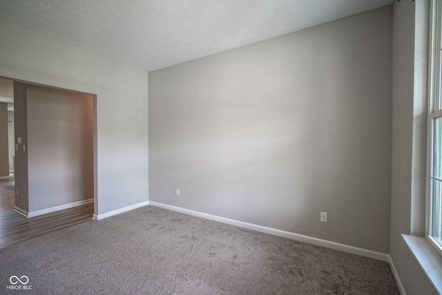 2541 Riviera Pl, Greenwood, IN 46143 - unfurnished room featuring dark carpet and baseboards