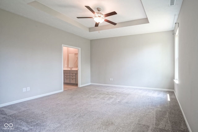 2541 Riviera Pl, Greenwood, IN 46143 - unfurnished room featuring light carpet, ceiling fan, and a tray ceiling