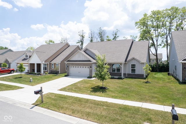 2541 Riviera Pl, Greenwood, IN 46143 - craftsman-style home featuring board and batten siding, driveway, an attached garage, and a front lawn
