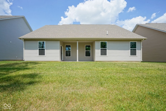2541 Riviera Pl, Greenwood, IN 46143 - rear view of house with a lawn and roof with shingles