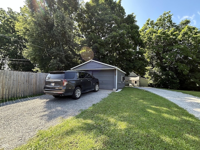 315 W N St, Crawfordsville, IN 47933 - view of front of home with a garage, driveway, and an outbuilding