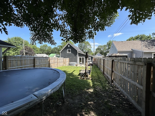 315 W N St, Crawfordsville, IN 47933 - fenced backyard with a trampoline