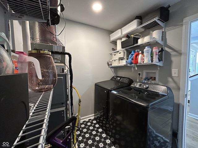 315 W N St, Crawfordsville, IN 47933 - washroom with washing machine and clothes dryer and baseboards