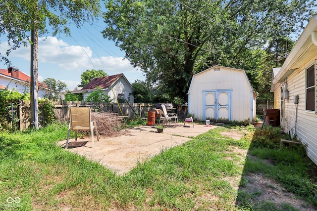209 Bishop St, Mooresville, IN 46158 - fenced backyard with a patio and a shed