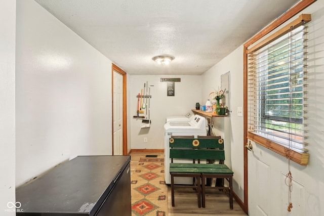 209 Bishop St, Mooresville, IN 46158 - laundry room with washing machine and clothes dryer, a textured ceiling, and light wood-type flooring