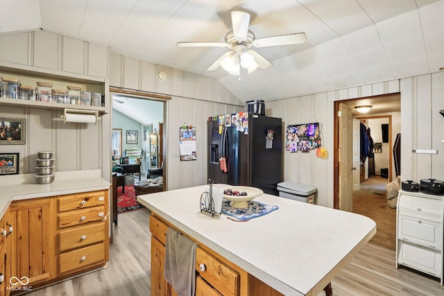 209 Bishop St, Mooresville, IN 46158 - kitchen with black fridge, lofted ceiling, light wood-style floors, a ceiling fan, and light countertops