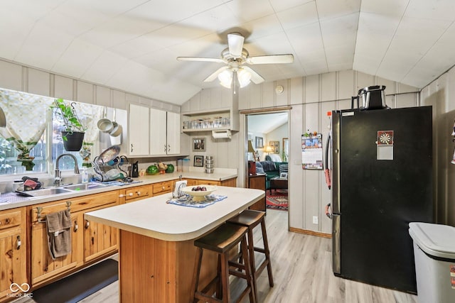 209 Bishop St, Mooresville, IN 46158 - kitchen featuring freestanding refrigerator, lofted ceiling, light wood-style flooring, light countertops, and ceiling fan