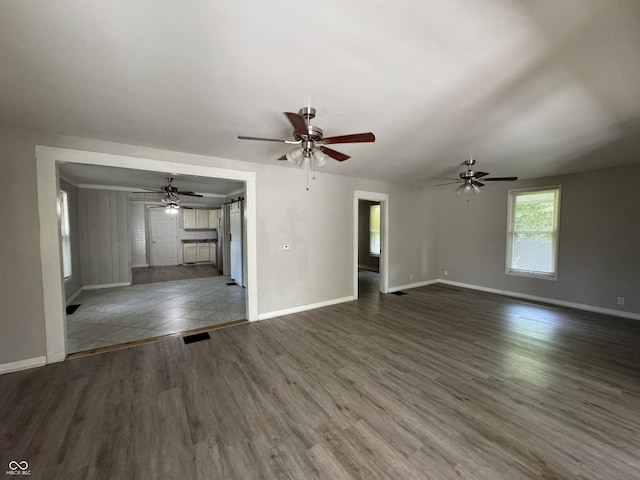 2002 N Audubon Rd, Indianapolis, IN 46218 - unfurnished living room featuring dark wood finished floors and a ceiling fan