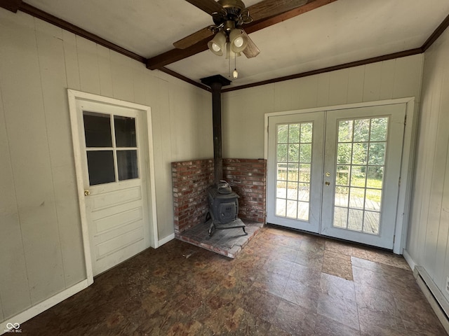 2002 N Audubon Rd, Indianapolis, IN 46218 - unfurnished living room featuring a baseboard radiator, a wood stove, french doors, a ceiling fan, and beam ceiling