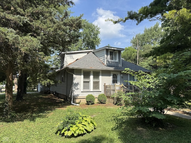 2002 N Audubon Rd, Indianapolis, IN 46218 - view of front of house with a shingled roof and a front lawn