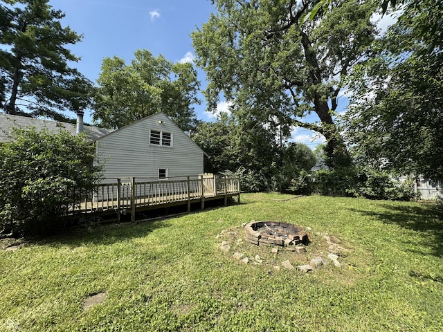 2002 N Audubon Rd, Indianapolis, IN 46218 - view of grassy yard featuring a fire pit and a deck