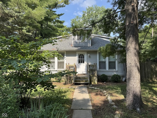 2002 N Audubon Rd, Indianapolis, IN 46218 - bungalow-style home featuring a shingled roof