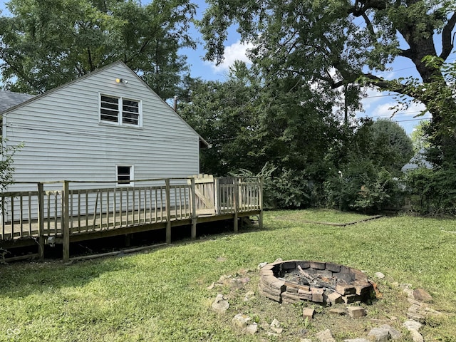 2002 N Audubon Rd, Indianapolis, IN 46218 - view of green lawn with a fire pit and a deck