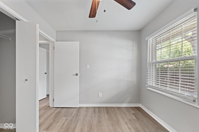 3102 Pawnee Dr, Indianapolis, IN 46235 - unfurnished bedroom with wood finished floors and ceiling fan