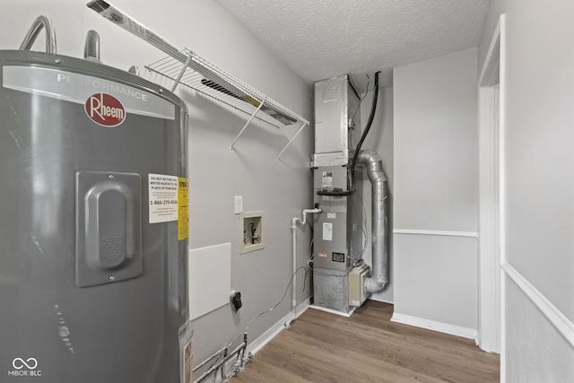 3102 Pawnee Dr, Indianapolis, IN 46235 - utility room featuring electric water heater and heating unit